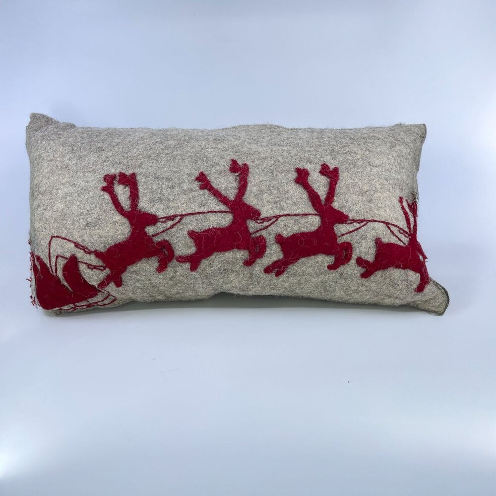 handmade wool felt rectangular pillow with red sleigh and reindeer design